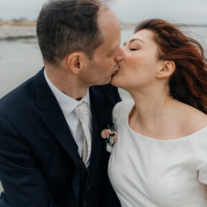Intimate wedding at the beach in countryside of Copenhagen focused on real emotions, connection, and love. Wedding photographer in Copenhagen with a documentary style.